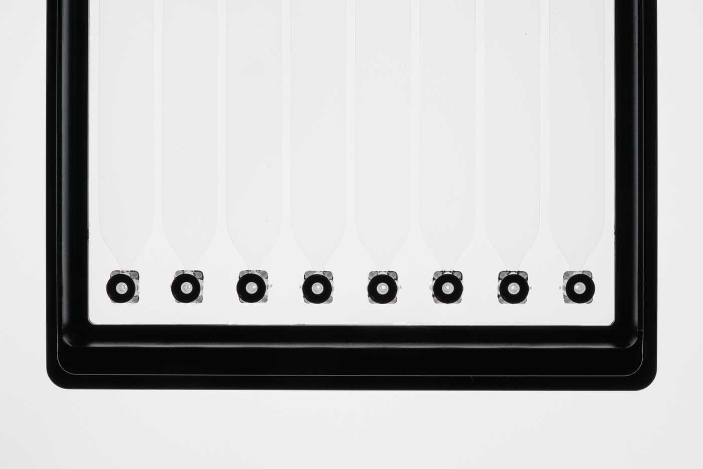 Half of a SLAS format microfluidic device with eight pipette interfaces
