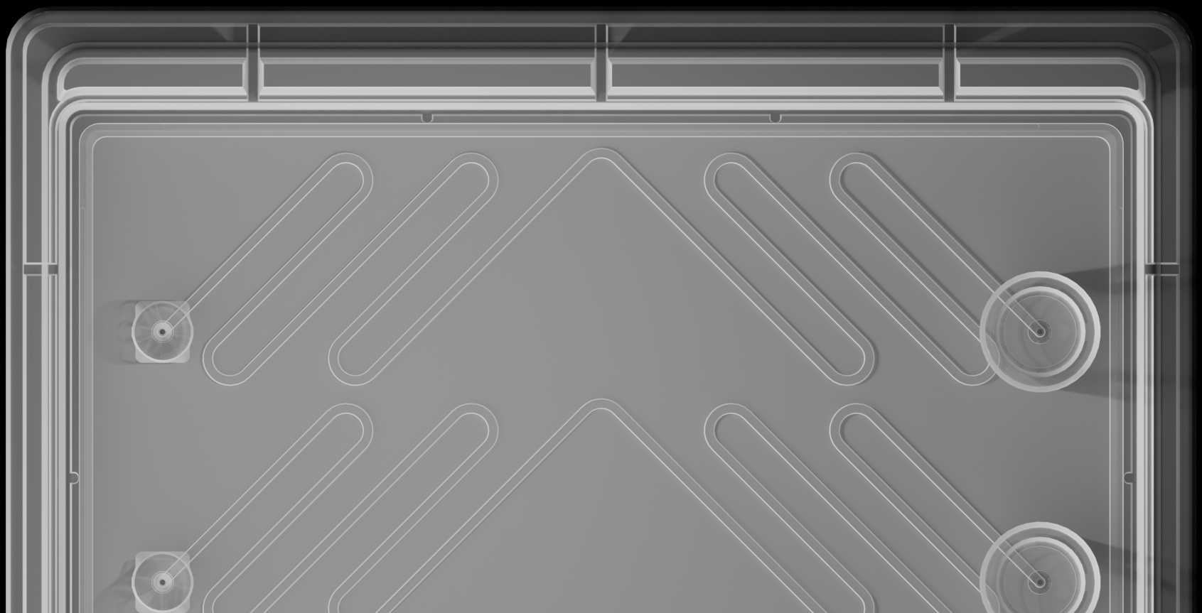Top view of the reference device. On top of the fluidic layer sits three ports to the left and a microvalve near the center.