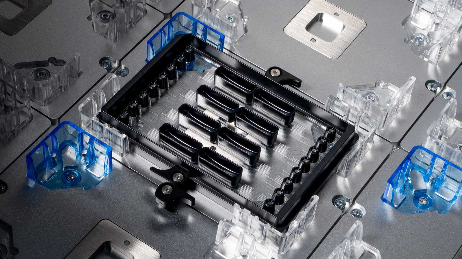 An LNP Screening Array microfluidic device on the deck of a liquid handler.